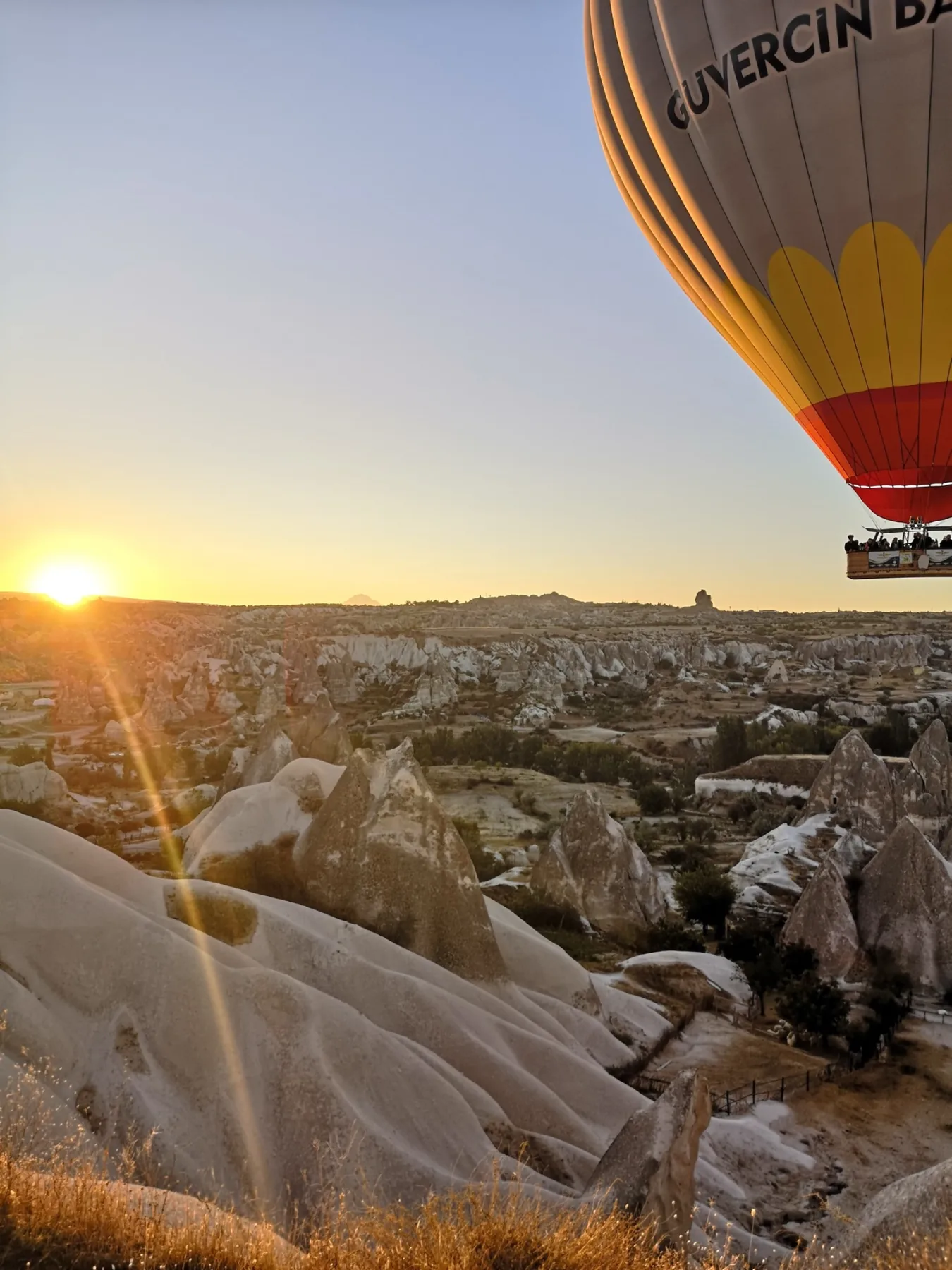 Cappadocia landscape with a hot air balloon at sunrise